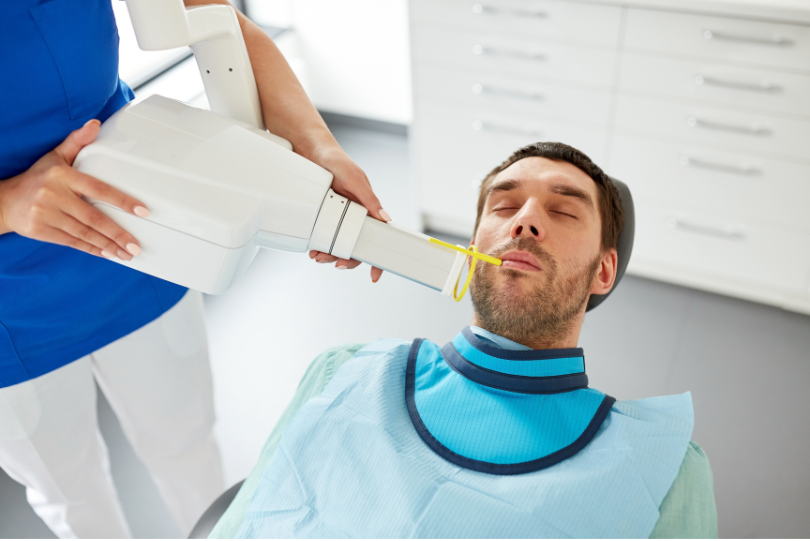 Patient getting x-ray at dentist office