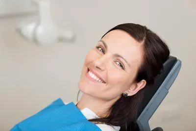 woman smiling during her appointment at Comprehensive Dentistry in Saline, MI