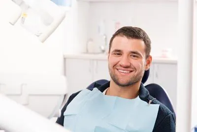 man smiling in the dental chair during his visit to Comprehensive Dentistry