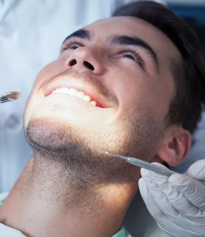 man receiving a dental checkup at Comprehensive Dentistry in Ypsilanti, MI