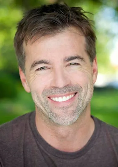 man showing off his freshly restored smile