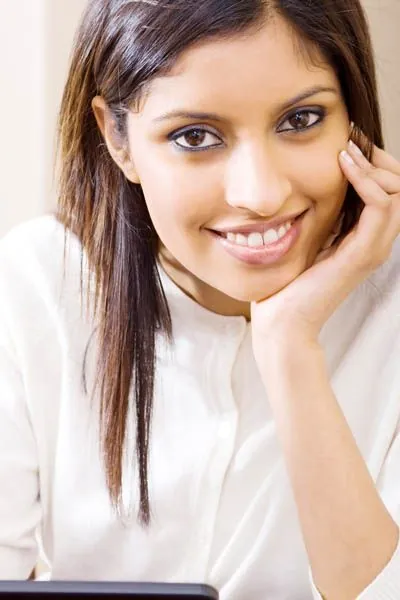 woman smiling after her dental appointment at Comprehensive Dentistry