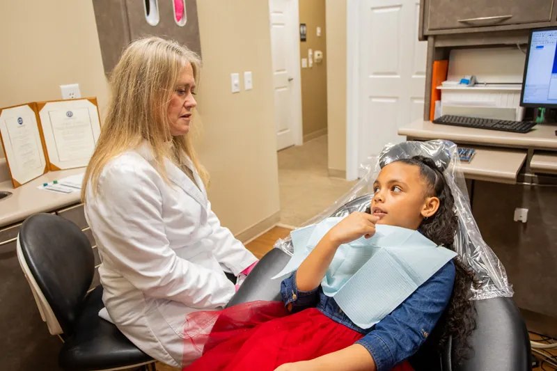 Dr. Bullard helping an emergency dental patient at Comprehensive Dentistry in Ypsilanti, MI
