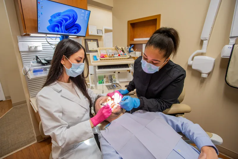 Dr. Hammoud providing emergency dental care at Comprehensive Dentistry in Ypsilanti, MI
