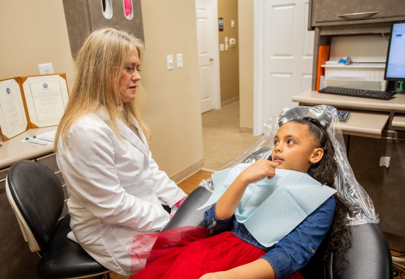 Ypsilanti, MI dentist Dr. Bullard of Comprehensive Dentistry treating a patient